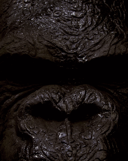 Close-up of a detailed gorilla sculpture highlighting texture.
