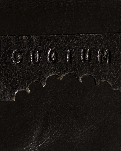 CUOIUM leather logo, showcasing love for natural materials.