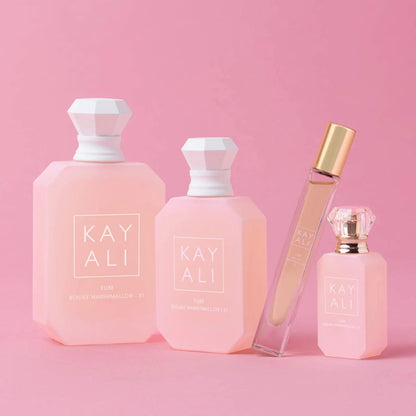 YUM BOUJEE MARSHMALLOW | 81 Eau de Parfum Intense bottles on pink background.